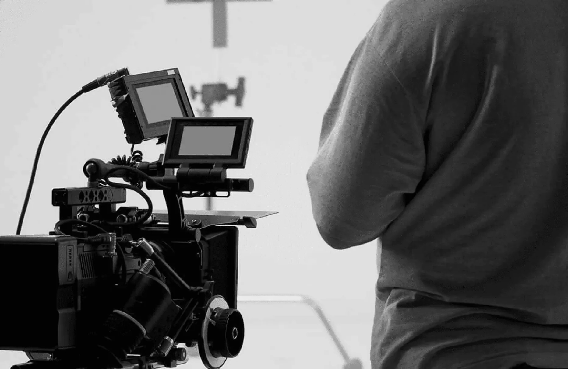 Behind the scenes with a cinema camera and crew member